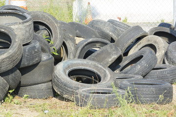 Used racer tires in a large pile