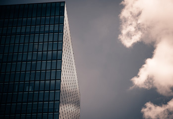 Reflection of a cloud on a skyscraper