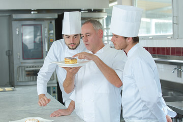 Chef advising apprentices