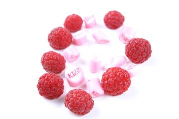 Raspberry on a glossy surface