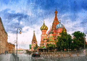 Moscow in the rain. Saint Basil's Cathedral in the evening light in Moscow, Russia. Rain on glass.