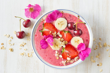 Smoothies with yogurt, strawberry, banana, cherry granola