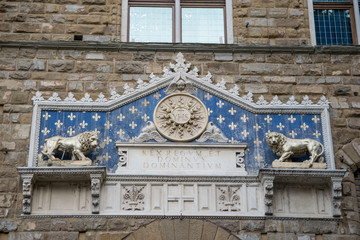 Details of the ornate facade at the main entrance of the Palazzo Vecchio in Florence