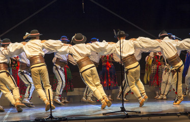 Folk dance in highland costumes from the region of Poland - obrazy, fototapety, plakaty