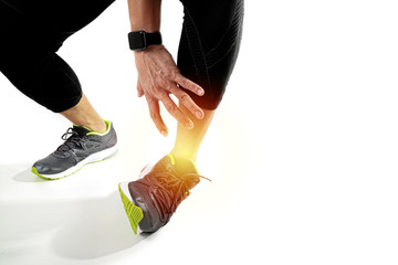 Runner sportsman holding ankle in pain with Broken twisted joint running sport injury and Athletic man touching foot due to sprain on white background - obrazy, fototapety, plakaty