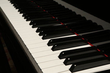 Black and white piano keys. Close up