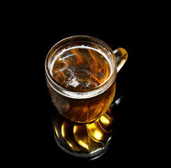 Vintage large glass of beer  on black background