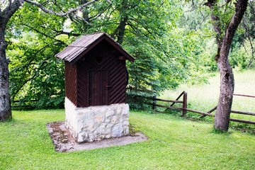 Old Vintage Stone Well. Ethno Village.