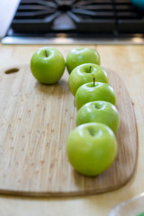Green Apples on Cutting Board