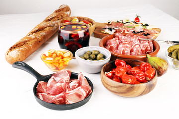 spanish tapas and sangria on wooden table - mediterran antipasti set