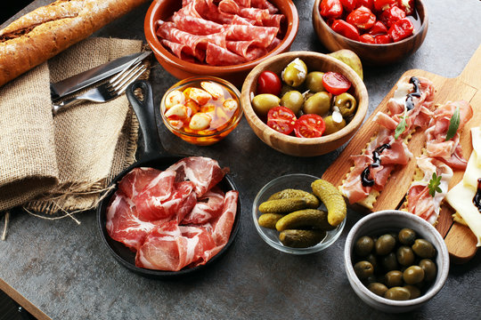 spanish tapas and sangria on wooden table - mediterran antipasti set