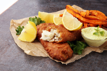 traditional British fish and chips on brown paper