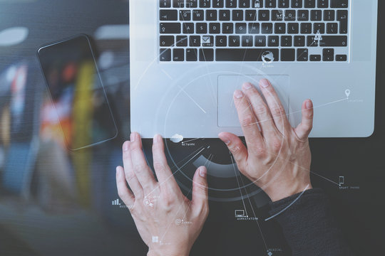 cyber security internet and networking concept.Businessman hand working with VR screen padlock icon mobile phone on laptop computer background