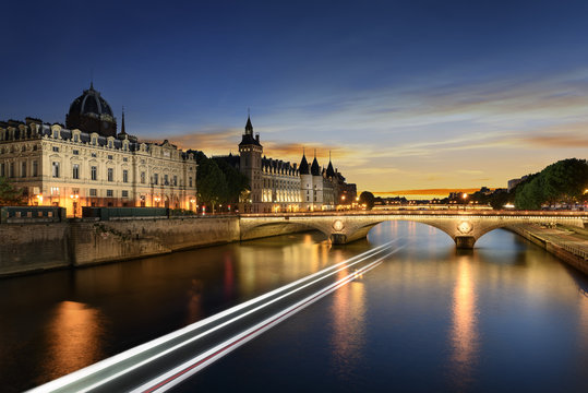 Boat tour on Seine river in Paris with sunset. Paris, France