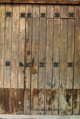 Window and wooden door in colonial house of La Antigua Guatemala, Central America.