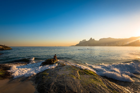 Waves Washing the Arpoador Rock During Sunset in Rio de Janeiro