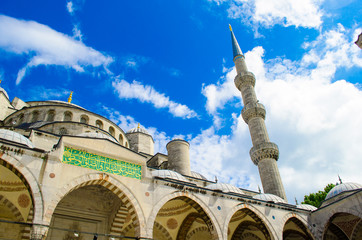 Fototapeta na wymiar Minaret of sultanahmet mosque and blue cloudy skies