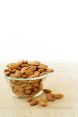 Glass bowl full of almonds