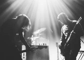 Foto op Canvas Rock band on a stage in a backlights © kondrukhov