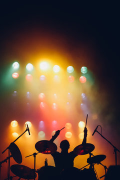 Drummer silhouette on a stage