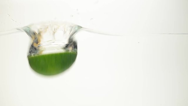 The lime falls in water.	Shooting in water.