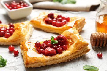 Delicious pastries on food paper, closeup