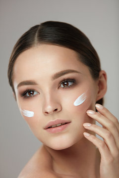 Woman Beauty Face Care. Portrait Of Female With Facial Cream