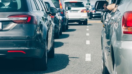 Cars in traffic jam row waiting 