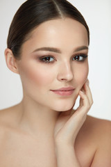 Woman Beauty Face. Female With Natural Makeup Touch Facial Skin