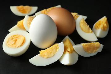 Hard boiled eggs on black background. Nutrition concept