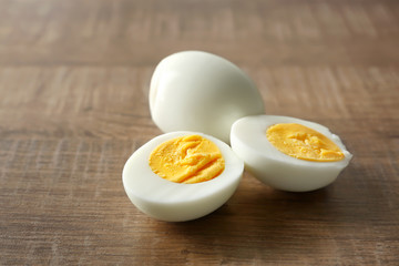Hard boiled eggs on wooden background. Nutrition concept