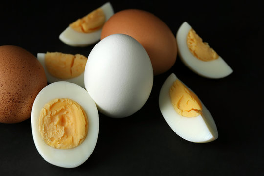 Hard boiled eggs on black background. Nutrition concept