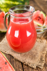 Wooden table with Watermelon Smoothie (selective focus)