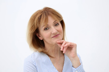 Portrait of attractive mature woman on white background