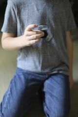 Little Boy Playing with a Fidget Spinner