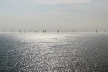 Fotobehang Offshore-Windpark im Meer. Windkraftanlage im Wasser © Astrid Gast