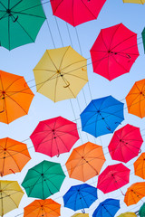Fototapeta na wymiar multicolored umbrellas in the sky