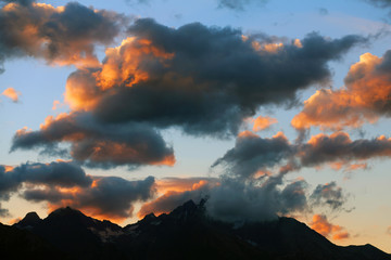 Orange clouds in the high mountains