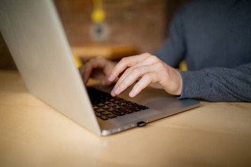 Laptop computer closeup of man browsing internet