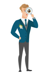Caucasian groom with magnifying glass.