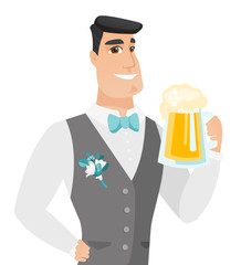 Young caucasian groom drinking beer.
