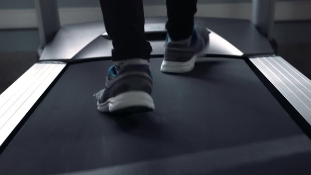 Exercising in the gym, treadmill cardio workout