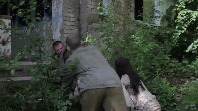 Zombies attack a man with a gun. Montage.