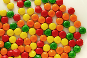 Obraz premium Rainbow candy / A variety of bite-sized chewy candies with a colorful candy shell