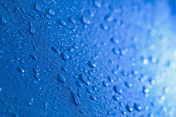 Rain Water droplets on  blue waterproof fabric