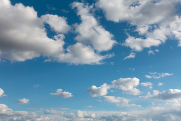 Beautiful clouds flying against blue sky at sunny day.