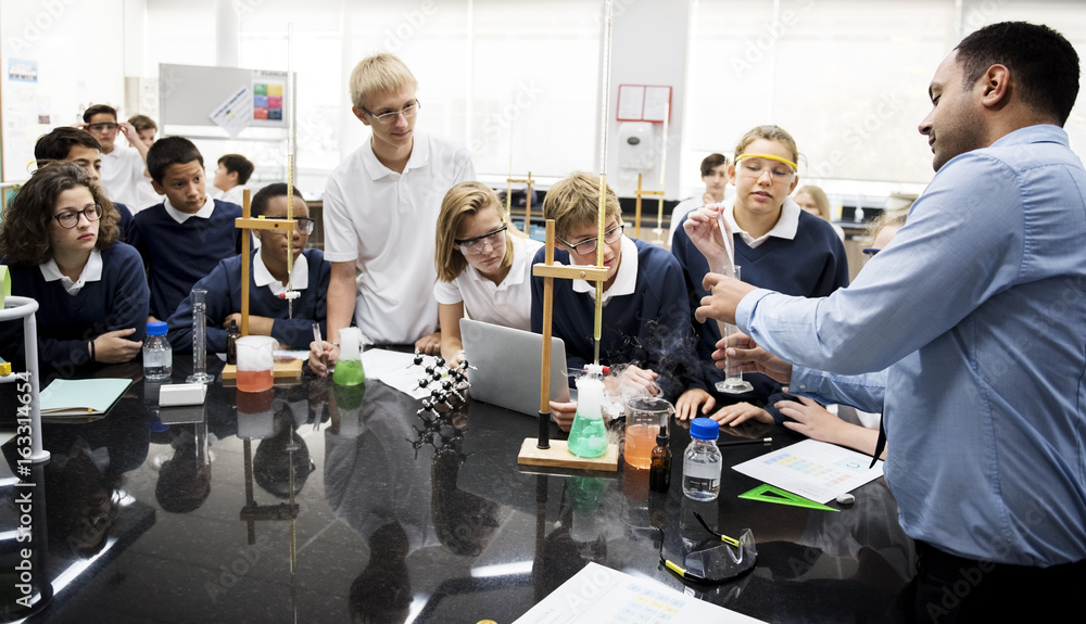 Wall mural group of students laboratory lab in science classroom