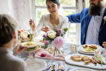 Bride Getting Food From Plate in Wedding Reception
