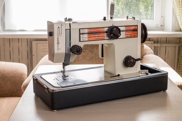  Vintage Sewing machine on a wooden table