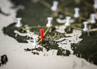 Closeup of pins on world map journey travel